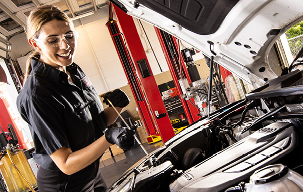 Mechanic working on car engine