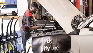 Men checking the car engine