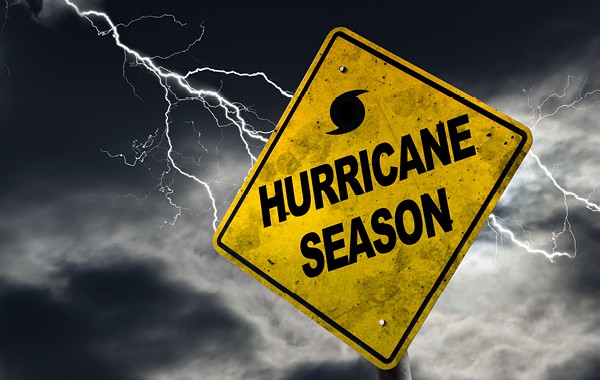 Hurricane season warning sign in yellow