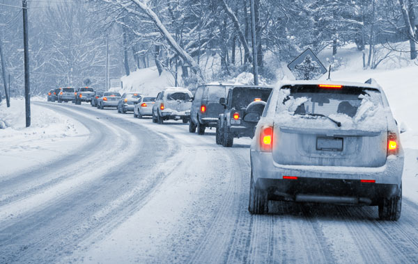 cars on the road in the winter