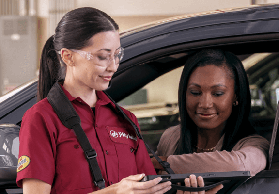 Sales girl showing the best option for customer cars