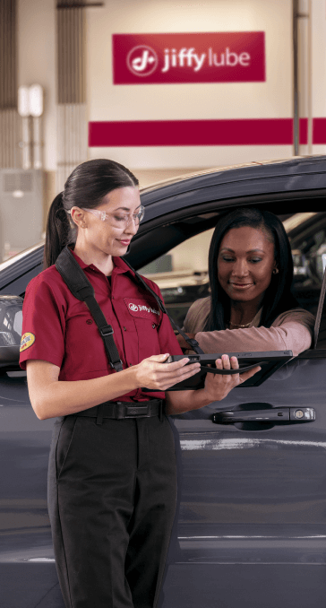 Sales girl showing the best option for customer cars