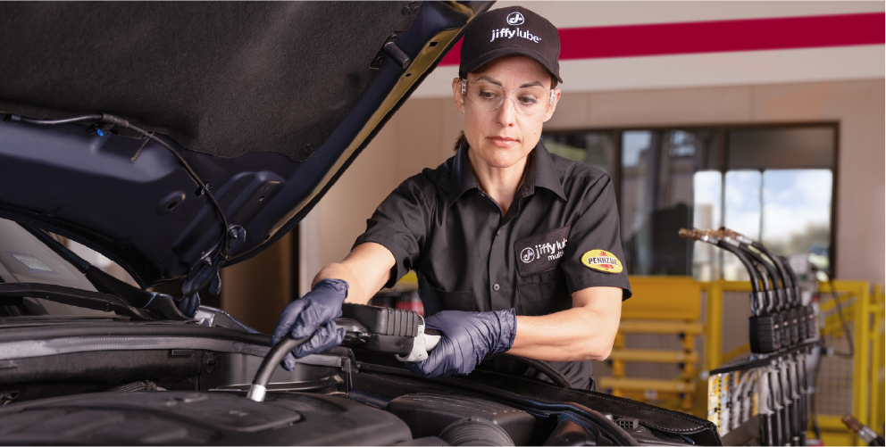 Woman performing oil change tablet sized artwork
